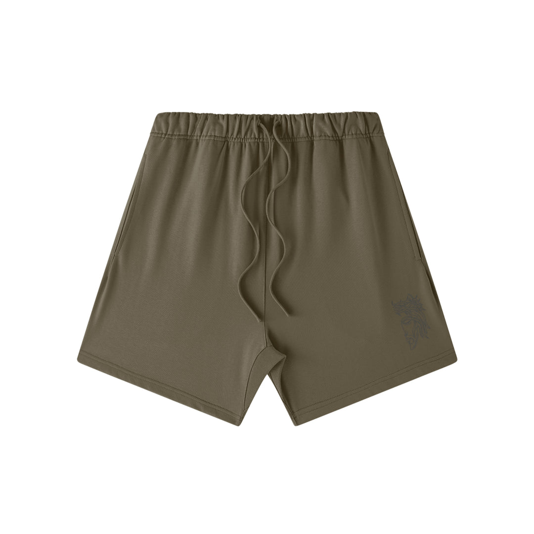 Front studio flat lay view of the Foundations Series Heavyweight Unisex Sweat Short in a dark taupe colorway. Features premium high-density Christ Half Face line-art embroidery on the left front leg panel, an overbuilt single-casing topstitched waistband with heavy-gauge tonal drawstrings, and a modern right-above-the-knee cut silhouette in massive 425GSM combed cotton French terry fabric.