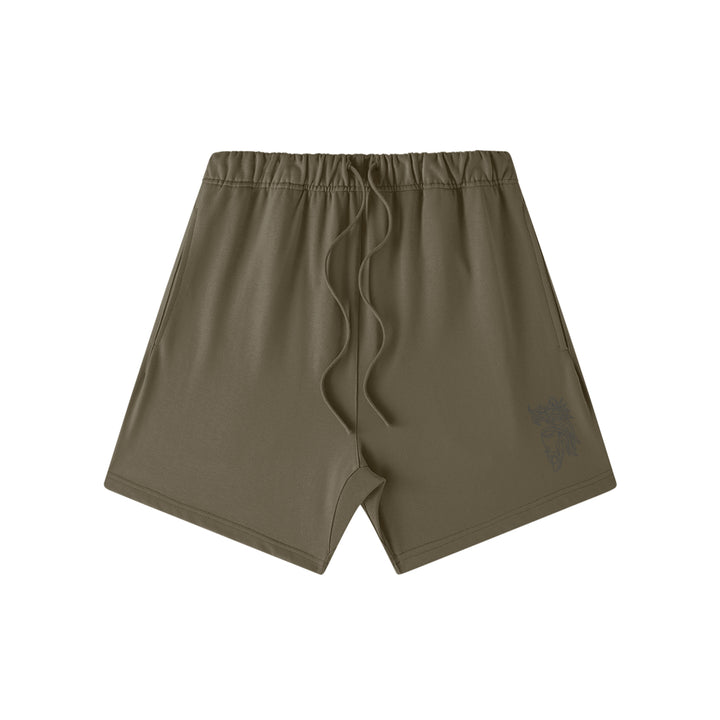 Front studio flat lay view of the Foundations Series Heavyweight Unisex Sweat Short in a dark taupe colorway. Features premium high-density Christ Half Face line-art embroidery on the left front leg panel, an overbuilt single-casing topstitched waistband with heavy-gauge tonal drawstrings, and a modern right-above-the-knee cut silhouette in massive 425GSM combed cotton French terry fabric.