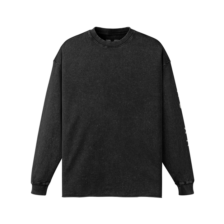 Front studio flat lay view of the Foundations Series 70X7 Raw Hem Long Sleeve in a sun-faded black tone. Showcases the premium boxy drop-shoulder silhouette, durable double-stitched ribbed collar, and character-driven raw-edge hem finish engineered from a substantial 260GSM enzyme-washed combed cotton canvas.