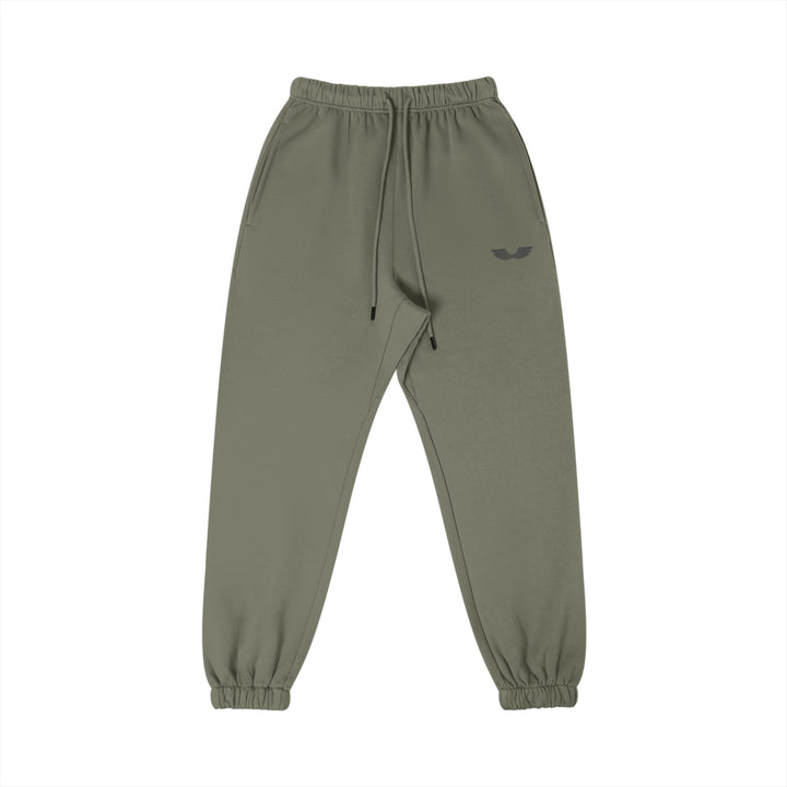 Front studio flat lay view of the Foundations Series Heavyweight Unisex Brushed Fleece Jogger in a charcoal grey tone, engineered as premium Christian streetwear. Features high-density Wings Emblem embroidery on the left thigh, a single-casing comfort waistband with heavy-gauge cotton drawstrings and black metal aglets, and elastic ankle cuffs built for a technical stacking silhouette. This structural 380GSM combed cotton piece represents mission-driven Christian clothing and pro-life Christian apparel.