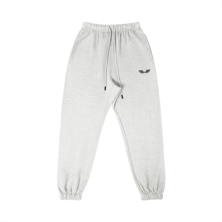 Front studio flat lay view of the Foundations Series Heavyweight Unisex Brushed Fleece Jogger in a classic heather grey tone, designed as premium Christian streetwear. Features high-density Wings Emblem premium embroidery on the left thigh, an overbuilt single-casing comfort waistband with heavy-gauge cotton drawstrings and black metal aglets, and gathered ankle cuffs on a structural 380GSM combed cotton relaxed tapered canvas for mission-driven Christian clothing and apparel.
