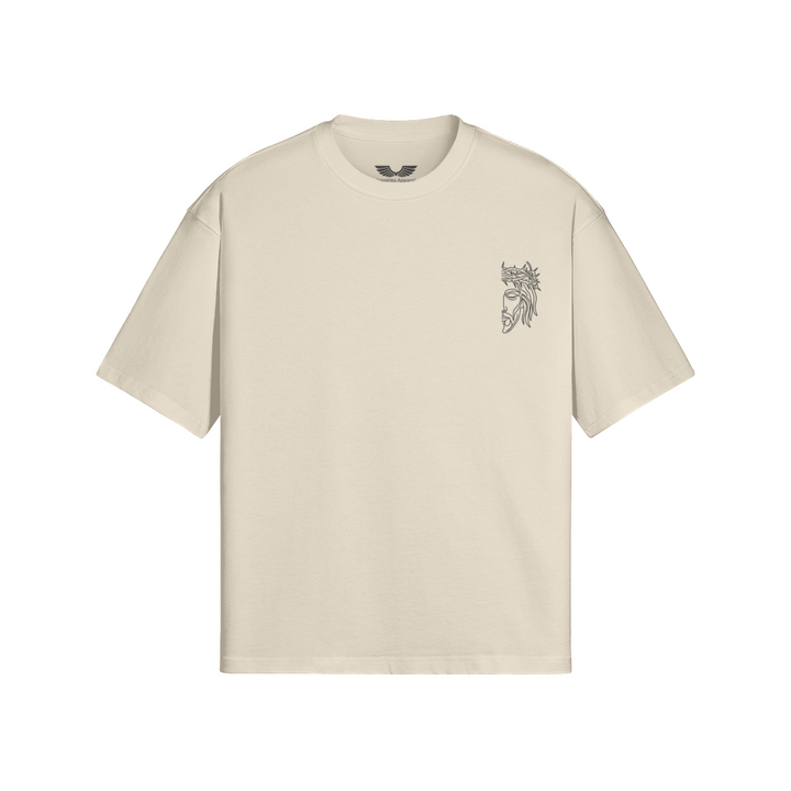 Front studio flat lay view of the Foundations Series Unisex Embroidered Boxy Tee in an apricot tone, designed as premium Christian streetwear. Features a relaxed, architectural boxy silhouette with dropped shoulders engineered from massive 280GSM heavyweight combed cotton, highlighted by the high-stitch count Christ Half Face line-art embroidery on the chest and a heavy-duty double-stitched ribbed collar for a mission-driven Christian clothing statement piece.