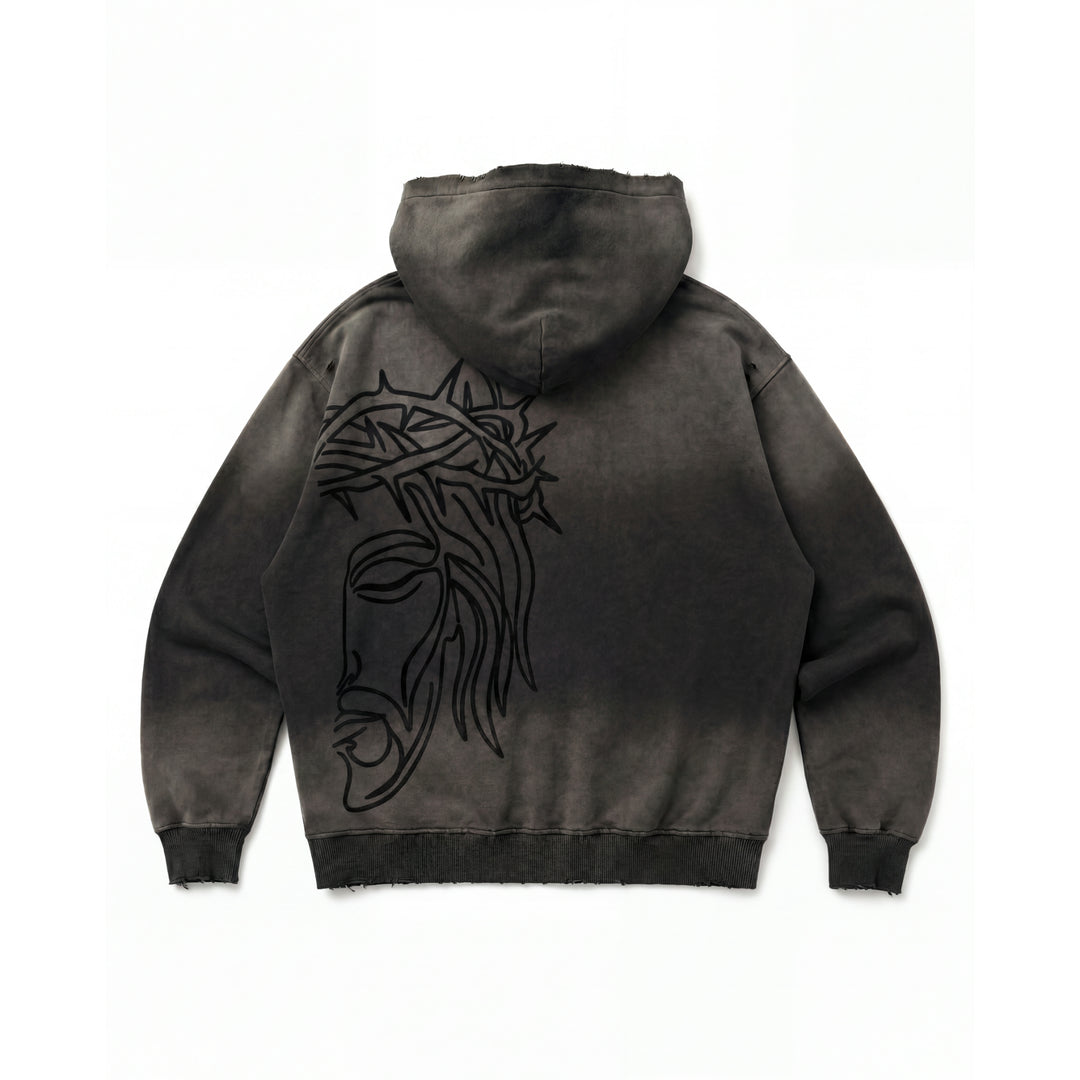 Rear studio flat lay view of the Foundations Series Crown of Thorns Heavyweight Hoodie in faded and distressed black. Features a jumbo line-art screen print of the Crown of Thorns across the back, custom pigment-dyed stone-washed finish, ultra-dense 440GSM combed cotton fabric, a boxy oversized silhouette, and hand-distressed grinding on the hood, cuffs, and hem.