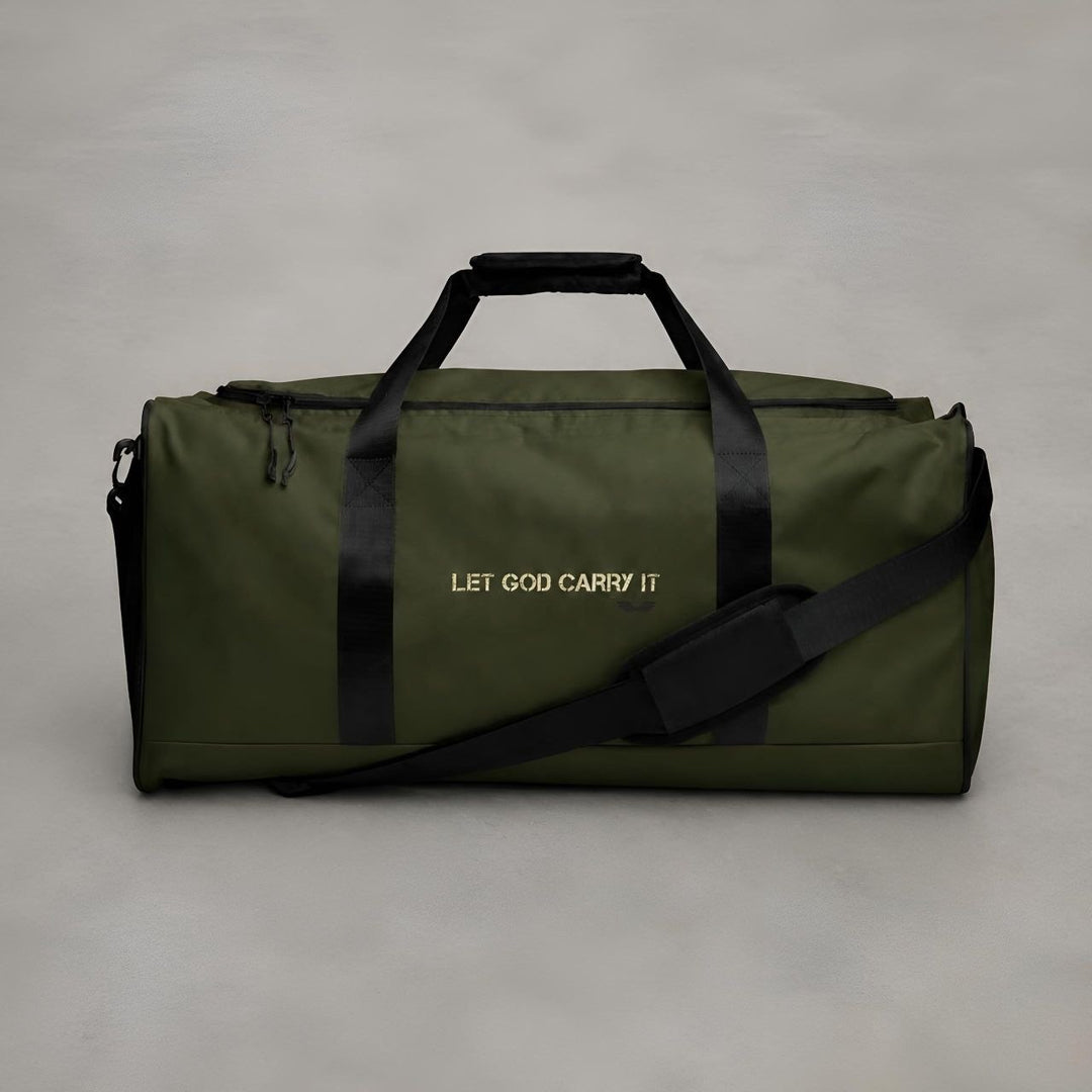 Straight-on front studio view of the Foundations Series Let God Carry It Utility Duffle Bag in olive green. Centers the crisp architectural typography across the chassis, showcasing the dual padded handles, attached adjustable padded shoulder strap, and the rigid 50L capacity streetwear luggage structure.